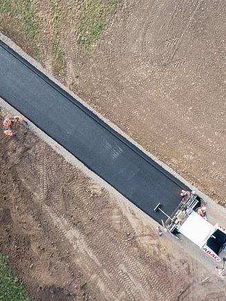 Recycled road surfaces being laid by our site team.