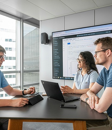 Photo of people wokring in a meeting room