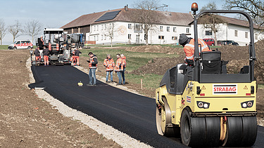 Photo of the placement of recycled asphalt