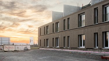 Photograph of a residential building constructed using a standardised timber-frame method