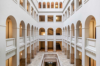 Photo of the distinctive atrium and other hallmarks of the Peter-Behrens-Bau are being perserved.