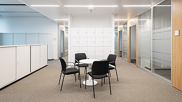 Interior of the Esslingen District Office with conference table and cupboards, equipped with resource-saving materials