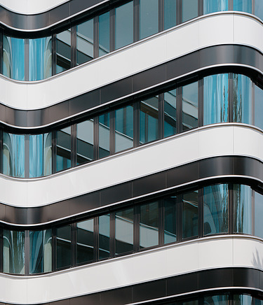 Modern building façade with glass and metal as an example of innovative and sustainable construction methods
