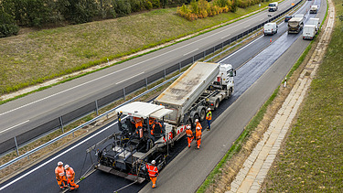 Moderately warm asphalt paving on the M60 motorway