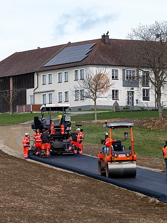 Asphalt with 70 % recycled content being laid.