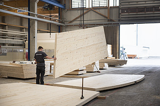 State-of-the-art manufacturing techniques for sustainable timber construction Photo of wood building production