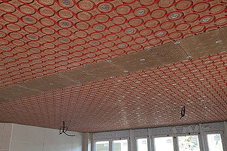 Photo of ceiling modules from clay with water-carrying pipes from AgrillaTherm