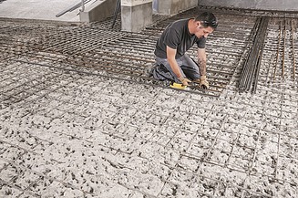 Photo of a construction worker doing reinforcement work